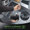 A person is cleaning a part of a juicer under a faucet in a kitchen sink. There are inset images showing juicer components being cleaned. Produktbild-Vorschau