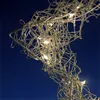 A close-up view of a silver wire star decoration with embedded LED lights against a dark blue background. Anteprima dell’immagine prodotto