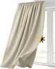 A beige curtain hanging in front of a window. Produktbild-Vorschau