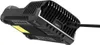 A black electronic device, likely a charger, is shown from a low angle with a cable plugged into it. The device has a ribbed texture and a yellow sticker on its underside. Podgląd zdjęcia produktu