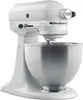 A white KitchenAid stand mixer with a silver bowl is shown against a white background. Produktbild-Vorschau