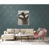 A living room scene with a sofa, armchair, and coffee table, showcasing wallpaper. Náhľad obrázku produktu