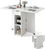 A white folding dining table with storage and wheels, set with plates, glasses, and bottles of wine. Náhľad obrázku produktu