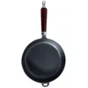 A cast iron frying pan with a dark wooden handle is shown against a white background. Podgląd zdjęcia produktu