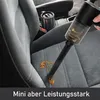 A handheld vacuum cleaner is being used to clean up a spill on a car seat. Produktbild-Vorschau