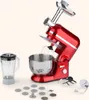 A red kitchen mixer with various attachments, including a meat grinder and blender jar, is displayed on a light gray background. Produktbild-Vorschau