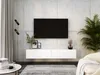 A modern living room with a wall-mounted TV and a white media console. Voir les images du produit