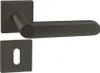 A black door handle set with a square rosette and a keyhole plate, presented on a white background. Produktbild-Vorschau