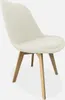 A single white boucle chair with wooden legs is shown against a plain white background. Produktbild-Vorschau