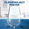 A clean wine glass in a kitchen setting, with text overlay. Podgląd zdjęcia produktu