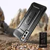 A rugged phone case is shown in a desert-like environment, suggesting durability and protection. Náhled obrázku produktu