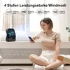 A woman is sitting on the floor in front of a window, holding a smartphone and looking at it. Next to her is a small black fan emitting a blue light. Produktbild-Vorschau