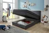 A bedroom scene with an open storage bed, a coat rack, and decorative items on the wall. Produktbild-Vorschau