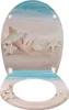 A toilet seat lid and seat with a beach and seashell design. Produktbild-Vorschau