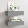 Two gray floating shelves mounted on a white wall, decorated with books, a plant, and a vase. Produktbild-Vorschau