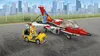 A LEGO jet and tow truck on an airport tarmac with a city skyline in the background. Produktbild-Vorschau