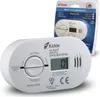 A white Kidde carbon monoxide detector is shown in the foreground, with its packaging in the background. Podgląd zdjęcia produktu