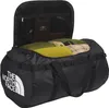 A black duffel bag with its top open, showing packed items inside. Produktbild-Vorschau
