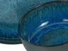 Close-up view of a blue ceramic bowl and a plate. Produktbild-Vorschau