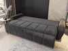 A modern living room with a gray sofa and a decorative wall. Produktbild-Vorschau