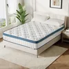 A mattress is displayed on a bed frame in a bedroom setting. Náhled obrázku produktu