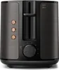 A front view of a black and bronze toaster. Anteprima dell’immagine prodotto