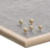 A close-up view of a bulletin board with pushpins. Produktbild-Vorschau