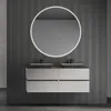 A modern bathroom vanity with two sinks and a round illuminated mirror. Náhled obrázku produktu