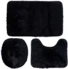 A set of three black bath mats arranged on a white background. Produktbild-Vorschau