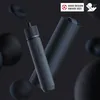 A cordless precision screwdriver and its case are displayed against a dark, abstract background with blurred spheres. Voir les images du produit