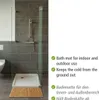 A modern bathroom with a shower and a bamboo bath mat. Produktbild-Vorschau