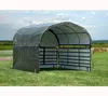 A portable shelter with metal gates and horses grazing in the background. Podgląd zdjęcia produktu