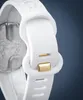A close-up shot of a white watch strap with gold accents. Náhled obrázku produktu