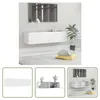A collage of images showing a white TV cabinet in different settings and angles. Náhled obrázku produktu
