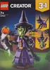 The image shows the packaging for a LEGO Creator 3-in-1 set, featuring a witch, a cat, and a dragon. The background depicts a spooky, nighttime scene with a haunted house. Podgląd zdjęcia produktu