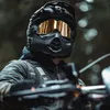 A person wearing a motorcycle helmet and jacket, riding a motorcycle. Produktbild-Vorschau