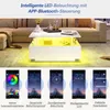 A modern white coffee table with LED lighting in a living room setting, shown with app interface examples. Voir les images du produit