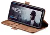 A brown flip cover phone case is shown with a smartphone inside displaying a movie poster. Produktbild-Vorschau