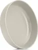 A close-up, angled view of a single beige ceramic plate. Náhled obrázku produktu