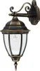 A classic outdoor wall lantern with a gold-bronze finish and clear glass panels. Voir les images du produit
