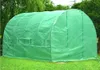 A green greenhouse tunnel is set up on a grassy lawn with trees in the background. Náhľad obrázku produktu