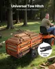 A man is riding a tractor and pulling a trailer full of logs. Anteprima dell’immagine prodotto