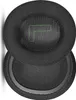 Two black ear pads for headphones are shown, one slightly overlapping the other. The top ear pad has a green 'L' shape logo on it. Náhled obrázku produktu