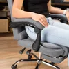 A person sitting in a gray office chair. Produktbild-Vorschau