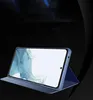 A blue smartphone case is displayed in a studio setting against a dark background. Náhled obrázku produktu