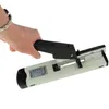 A hand is holding a stapler over a white background. Náhľad obrázku produktu