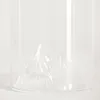 A close-up of the bottom of a clear glass whisky glass with a mountain-like design molded into the base. Podgląd zdjęcia produktu