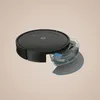 A black robot vacuum cleaner with a transparent water tank detached from its body, shown at an angle. Podgląd zdjęcia produktu