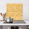A kitchen scene with a cutting board, a pot on a stove, and utensils. Anteprima dell’immagine prodotto