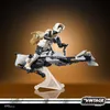 A Star Wars Scout Trooper figure riding a speeder bike, with Grogu in a satchel. Náhled obrázku produktu